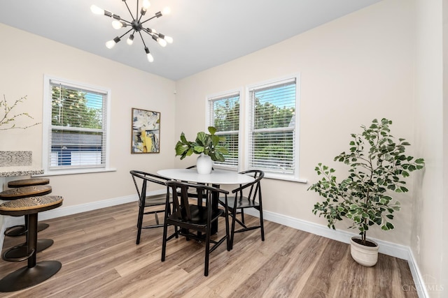 6213 Coleridge Ave, Cincinnati, OH 45213 - dining room with light wood-style floors, a chandelier, and plenty of natural light