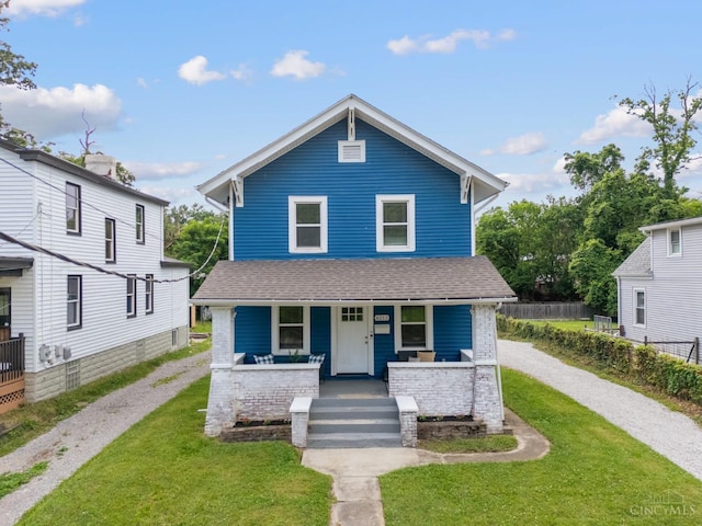 6213 Coleridge Ave, Cincinnati, OH 45213 - american foursquare style home featuring a porch, driveway, and roof with shingles