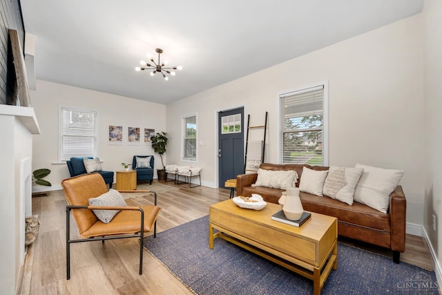 6213 Coleridge Ave, Cincinnati, OH 45213 - living room featuring wood finished floors and a chandelier