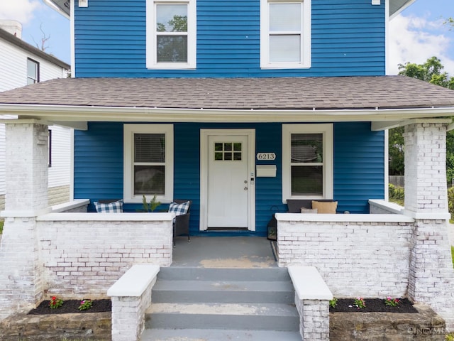 6213 Coleridge Ave, Cincinnati, OH 45213 - view of front facade featuring covered porch and a shingled roof