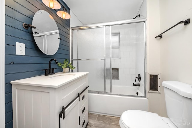 6213 Coleridge Ave, Cincinnati, OH 45213 - full bathroom with vanity, wood finished floors, and enclosed tub / shower combo