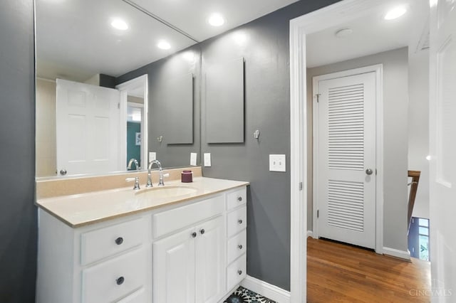 3862 Settle Rd, Mariemont, OH 45227 - bathroom with vanity, recessed lighting, and wood finished floors