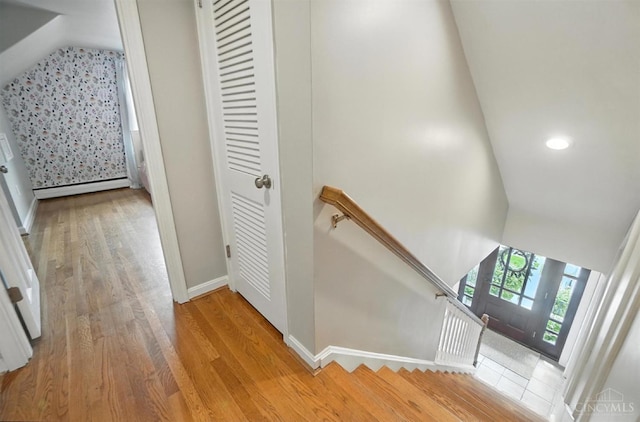 3862 Settle Rd, Mariemont, OH 45227 - stairway with lofted ceiling, baseboard heating, wood finished floors, and recessed lighting