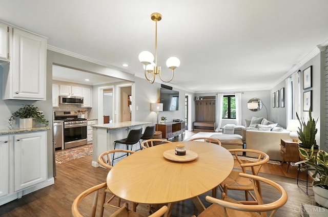 3862 Settle Rd, Mariemont, OH 45227 - dining space with ornamental molding, dark wood-type flooring, a chandelier, and recessed lighting