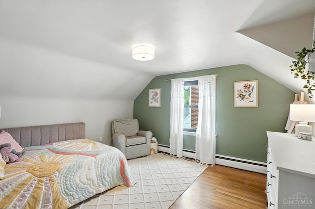3862 Settle Rd, Mariemont, OH 45227 - bedroom featuring light wood finished floors, baseboard heating, and lofted ceiling
