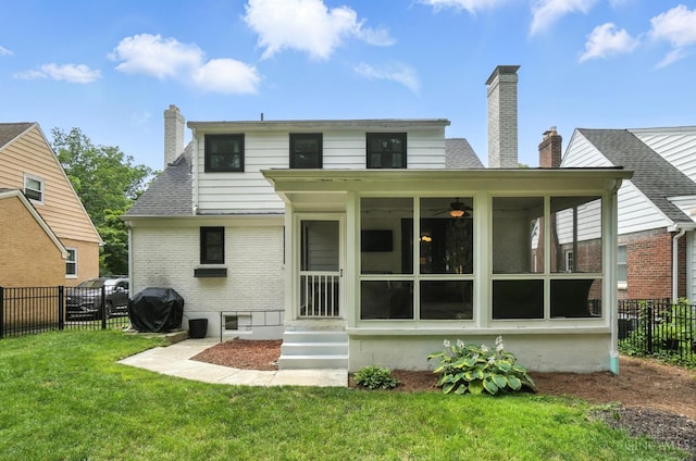 3862 Settle Rd, Mariemont, OH 45227 - rear view of property featuring brick siding, a sunroom, and a chimney
