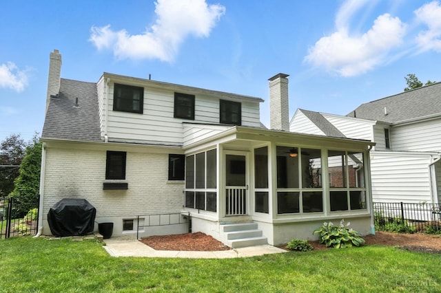 3862 Settle Rd, Mariemont, OH 45227 - rear view of house featuring a chimney, a sunroom, and brick siding