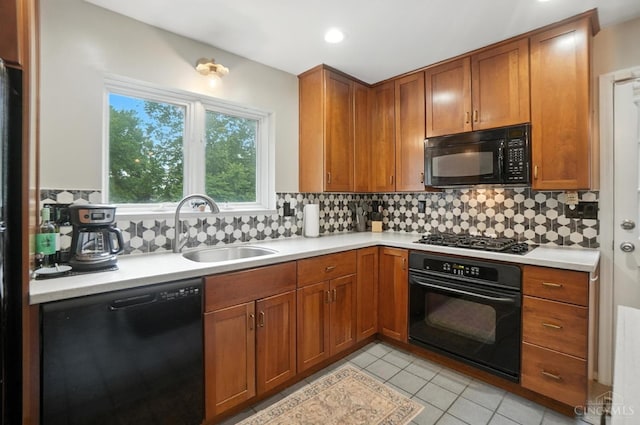 6159 Tulane Rd, Cincinnati, OH 45212 - kitchen with black appliances, light countertops, brown cabinets, and recessed lighting