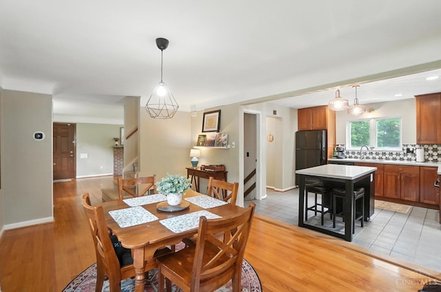6159 Tulane Rd, Cincinnati, OH 45212 - dining room with stairway and light wood-type flooring