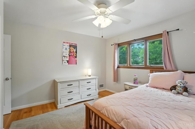 6159 Tulane Rd, Cincinnati, OH 45212 - bedroom with light wood-style flooring and a ceiling fan