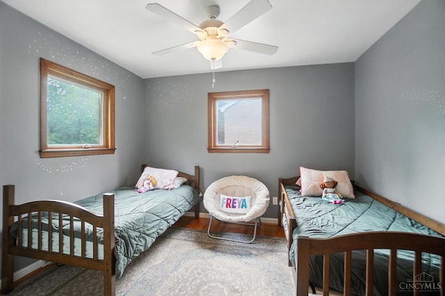 6159 Tulane Rd, Cincinnati, OH 45212 - bedroom with wood finished floors and ceiling fan