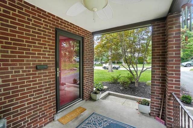 6159 Tulane Rd, Cincinnati, OH 45212 - property entrance featuring brick siding, ceiling fan, and a porch