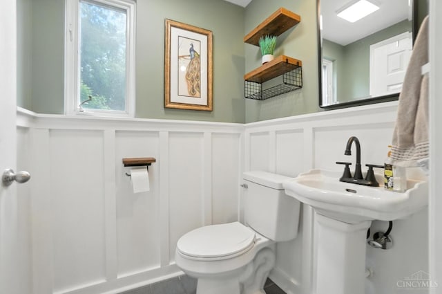 6159 Tulane Rd, Cincinnati, OH 45212 - half bathroom with a decorative wall and wainscoting