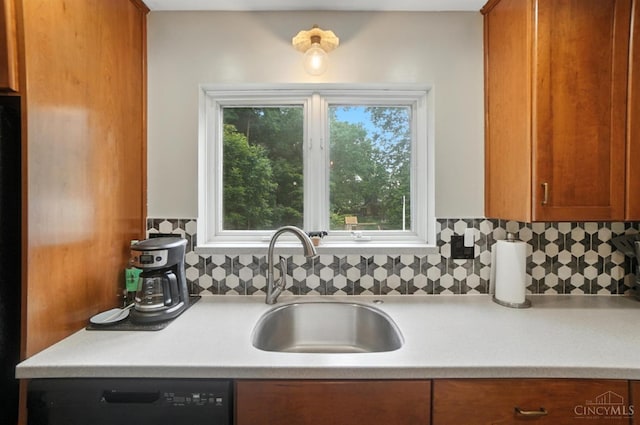 6159 Tulane Rd, Cincinnati, OH 45212 - kitchen featuring brown cabinets, light countertops, backsplash, and dishwasher