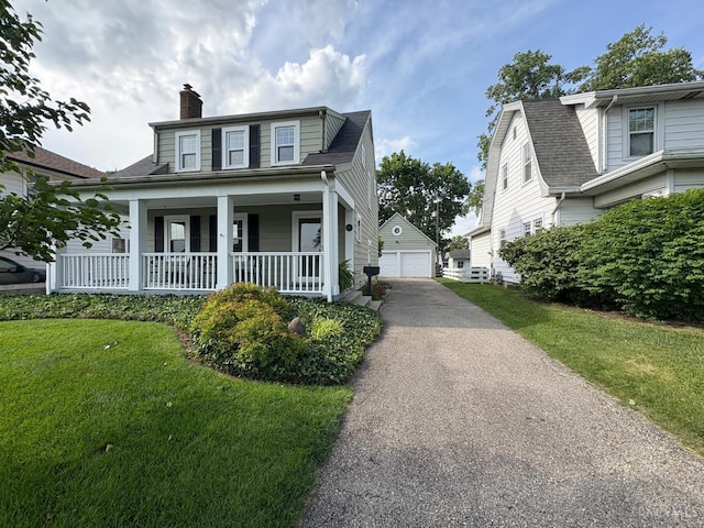 2617 Milton Rd, Middletown, OH 45042 - view of front of home with a chimney, a garage, covered porch, an outbuilding, and a front lawn