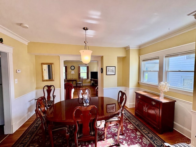 2617 Milton Rd, Middletown, OH 45042 - dining room with dark wood-style flooring, ornamental molding, and a wainscoted wall
