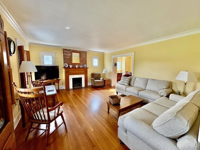 2617 Milton Rd, Middletown, OH 45042 - living room featuring wood finished floors, crown molding, and a fireplace