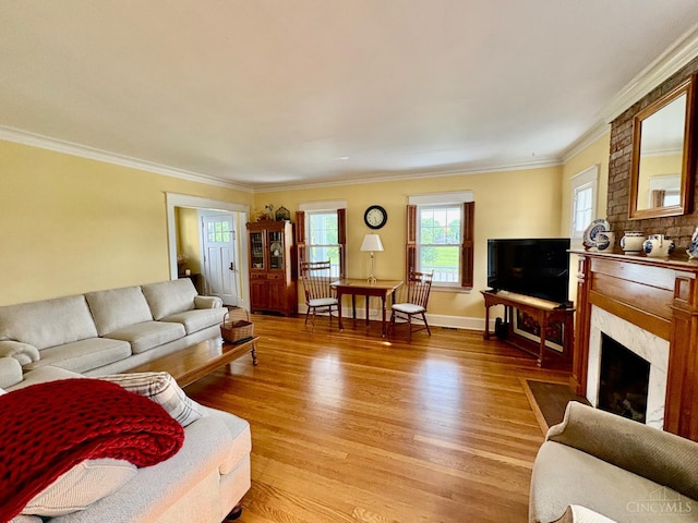 2617 Milton Rd, Middletown, OH 45042 - living room with light wood-style flooring, crown molding, and a premium fireplace