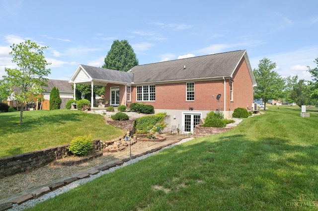 440 Waynoka Dr, Franklin Twp, OH 45171 - back of house with french doors, brick siding, and a yard