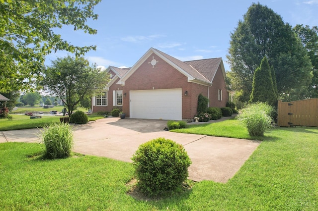 440 Waynoka Dr, Franklin Twp, OH 45171 - view of home's exterior with concrete driveway, brick siding, a lawn, and an attached garage