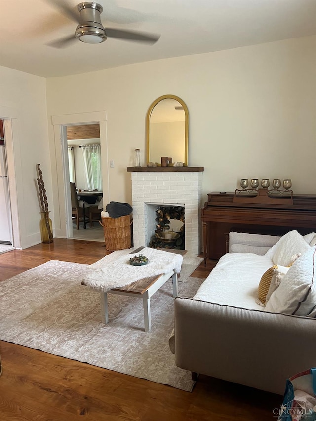 316 W S St, Hillsboro, OH 45133 - living area with a ceiling fan, a fireplace, and wood finished floors