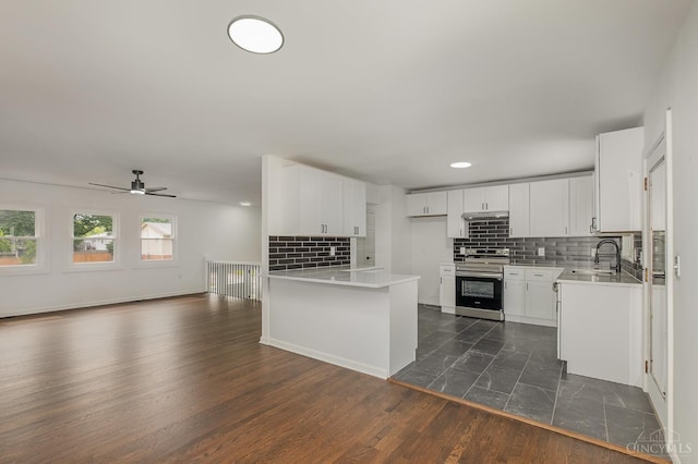 1407 Southwind Dr, Mason, OH 45040 - kitchen with electric range, open floor plan, backsplash, light countertops, and recessed lighting