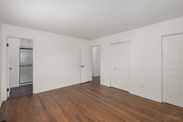 1407 Southwind Dr, Mason, OH 45040 - unfurnished bedroom with wood finished floors, two closets, and ensuite bath