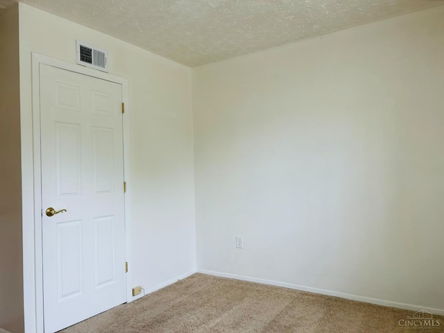 3744 Dina Ave, Cheviot, OH 45211 - spare room featuring carpet floors and a textured ceiling