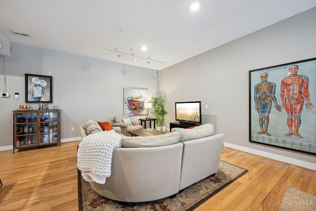 1150 Vine St Unit 15, Cincinnati, OH 45202 - living room with track lighting and light wood-style floors