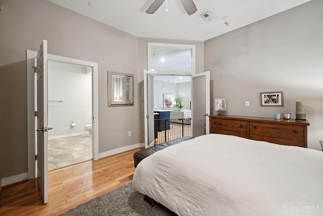 1150 Vine St Unit 15, Cincinnati, OH 45202 - bedroom featuring light wood-type flooring, a ceiling fan, and connected bathroom