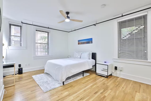 1407 Vine St Unit 203, Cincinnati, OH 45202 - bedroom with light wood-type flooring and a ceiling fan