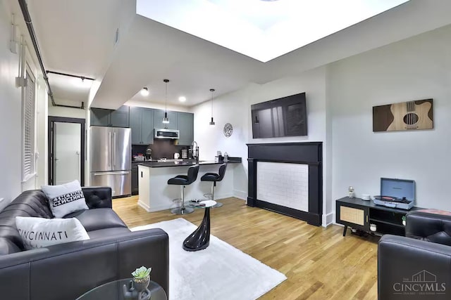 1407 Vine St Unit 203, Cincinnati, OH 45202 - living area with light wood finished floors and recessed lighting