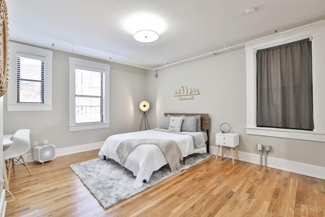 1407 Vine St Unit 303, Cincinnati, OH 45202 - bedroom featuring wood finished floors and baseboards