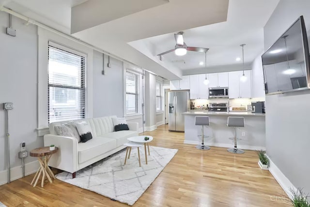 1407 Vine St Unit 303, Cincinnati, OH 45202 - living area featuring ceiling fan, light wood finished floors, and recessed lighting