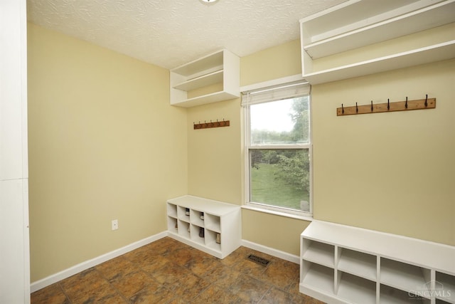 3779 Windyhollow Way, Mason, OH 45040 - mudroom with a textured ceiling and stone finish floors