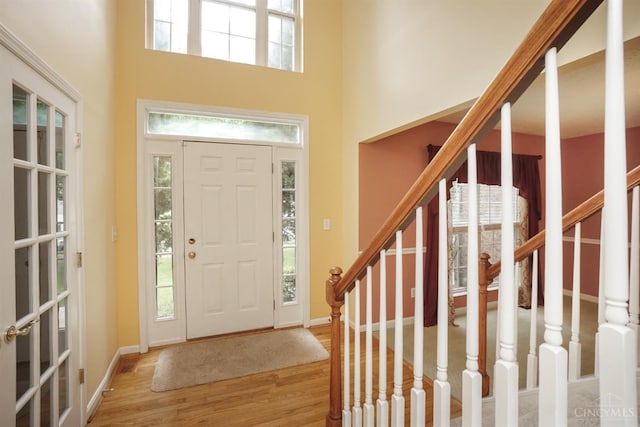 3779 Windyhollow Way, Mason, OH 45040 - foyer with wood finished floors, stairway, and a high ceiling