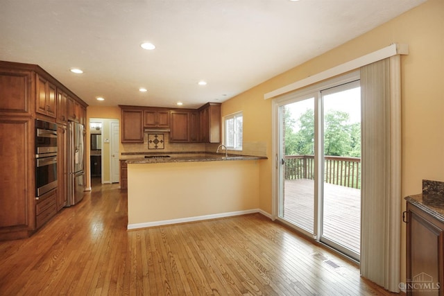 3779 Windyhollow Way, Mason, OH 45040 - kitchen featuring appliances with stainless steel finishes, light wood-style floors, recessed lighting, and brown cabinets