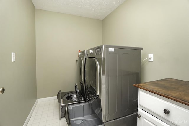 3779 Windyhollow Way, Mason, OH 45040 - washroom featuring washer and clothes dryer, cabinet space, and a textured ceiling