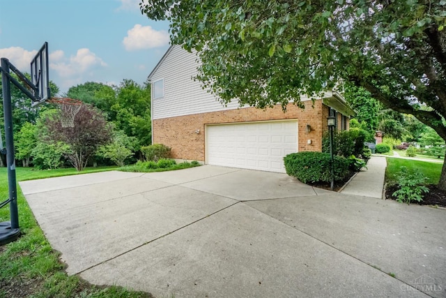 3779 Windyhollow Way, Mason, OH 45040 - view of property exterior featuring brick siding, a garage, a lawn, and driveway