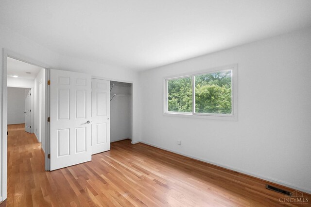 3057 Fox Den Ln, Anderson Twp, OH 45244 - unfurnished bedroom with light wood finished floors and a closet