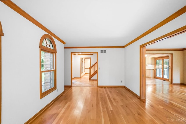 3057 Fox Den Ln, Anderson Twp, OH 45244 - unfurnished room with light wood-style flooring, ornamental molding, and stairs