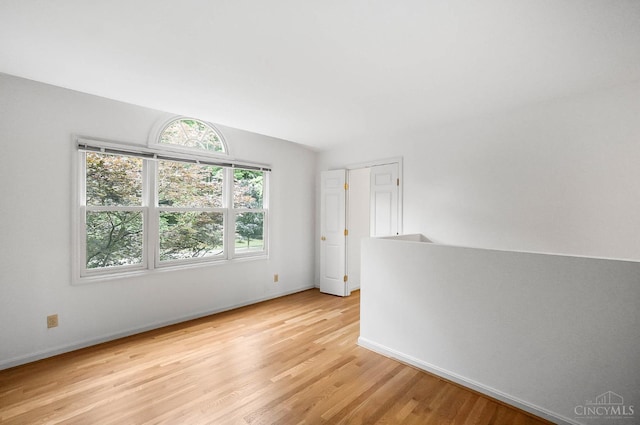3057 Fox Den Ln, Anderson Twp, OH 45244 - unfurnished room featuring light wood-type flooring and vaulted ceiling