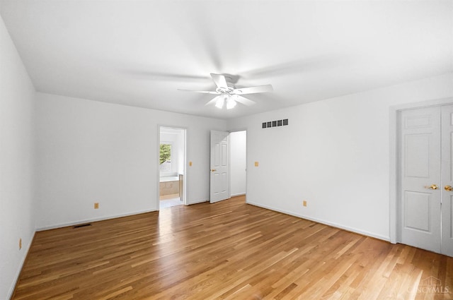 3057 Fox Den Ln, Anderson Twp, OH 45244 - unfurnished bedroom with light wood finished floors, ensuite bathroom, and ceiling fan