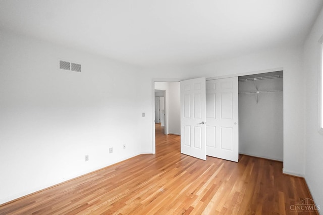 3057 Fox Den Ln, Anderson Twp, OH 45244 - unfurnished bedroom featuring light wood-style flooring and a closet