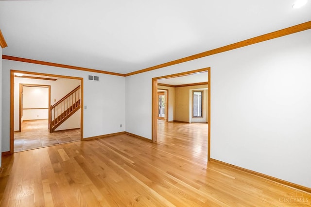 3057 Fox Den Ln, Anderson Twp, OH 45244 - unfurnished room with light wood finished floors, ornamental molding, and stairway