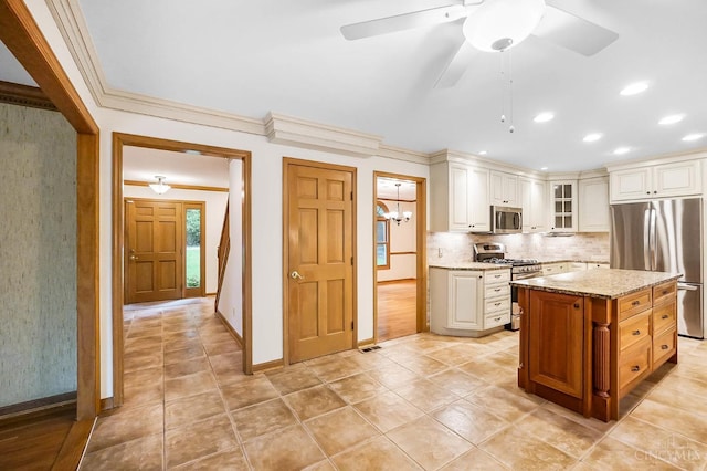 3057 Fox Den Ln, Anderson Twp, OH 45244 - kitchen featuring stainless steel appliances, glass insert cabinets, light stone counters, decorative backsplash, and ornamental molding