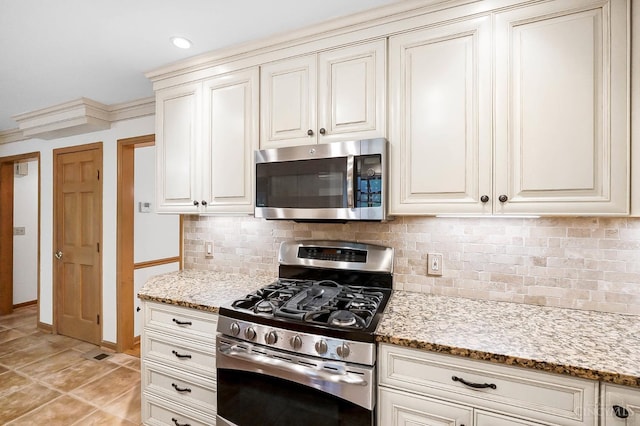 3057 Fox Den Ln, Anderson Twp, OH 45244 - kitchen featuring stainless steel appliances, tasteful backsplash, and light stone counters