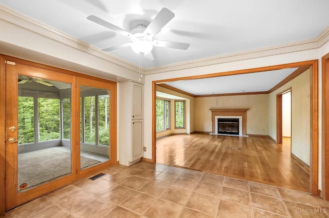 3057 Fox Den Ln, Anderson Twp, OH 45244 - unfurnished living room featuring ceiling fan, crown molding, a fireplace with flush hearth, and light wood finished floors