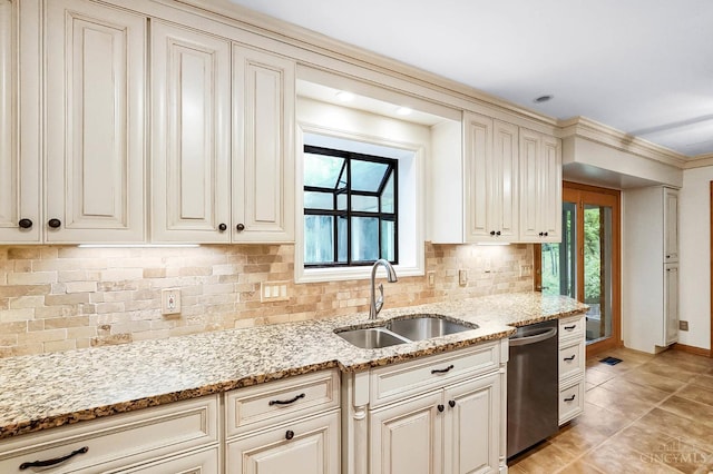 3057 Fox Den Ln, Anderson Twp, OH 45244 - kitchen with stainless steel dishwasher, tasteful backsplash, cream cabinetry, light stone counters, and light tile patterned flooring