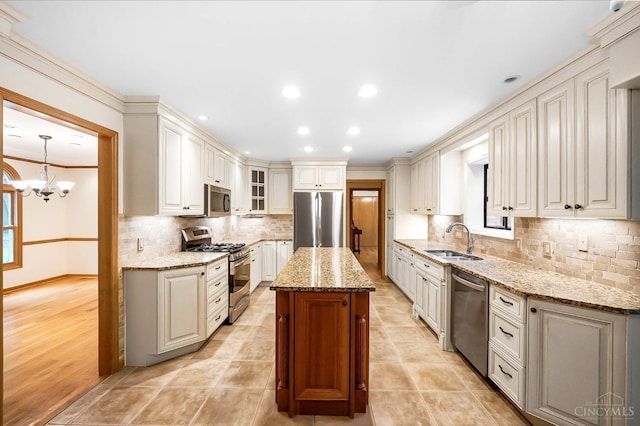 3057 Fox Den Ln, Anderson Twp, OH 45244 - kitchen with stainless steel appliances, backsplash, light stone counters, glass insert cabinets, and a center island
